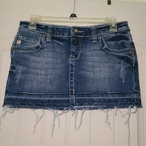 Distressed denim mini skirt
